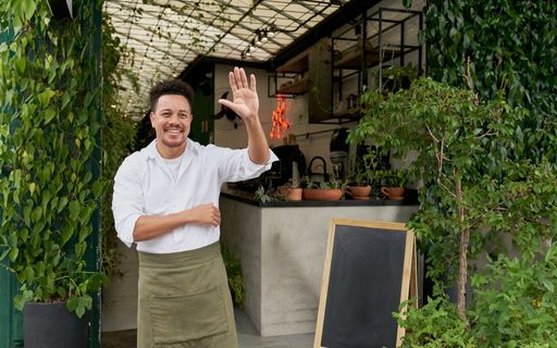 business owner waving